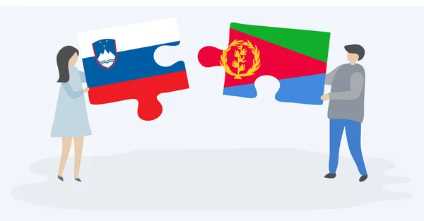 スロベニアとエリトリアの旗を持つ2つのパズルピースを保持しているカップル スロベニアとエリトリアのシンボル — ストックベクタ