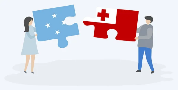 Para Trzyma Dwa Puzzle Kawałki Mikronezyjskich Tongan Flagi Symbole Narodowe — Wektor stockowy