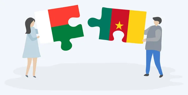 Çift Malagasy Kamerun Bayrakları Ile Iki Bulmaca Parçaları Tutan Madagaskar — Stok Vektör