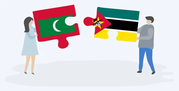 Pareja Sosteniendo Dos Piezas Rompecabezas Con Banderas Maldivas Mozambiqueñas Maldivas — Vector de stock