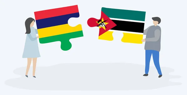 Pareja Sosteniendo Dos Piezas Rompecabezas Con Banderas Mauricio Mozambique Mauricio — Vector de stock