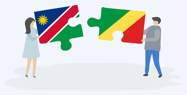 Pareja Sosteniendo Dos Piezas Rompecabezas Con Banderas Namibia Congo Namibia — Vector de stock