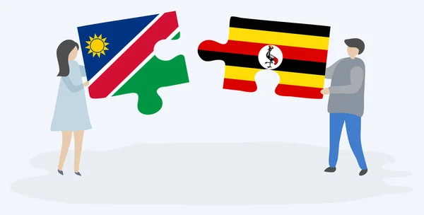 Casal Segurando Duas Peças Quebra Cabeças Com Bandeiras Namibianas Ugandenses —  Vetores de Stock