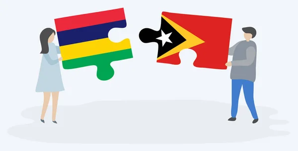 Paar Houden Twee Puzzels Stukken Met Mauritiaanse Timorese Vlaggen Nationale — Stockvector
