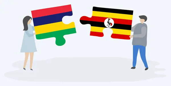 Para Trzymania Dwóch Puzzli Maurytyjskiej Ugandy Flagi Mauritius Uganda Symbole — Wektor stockowy