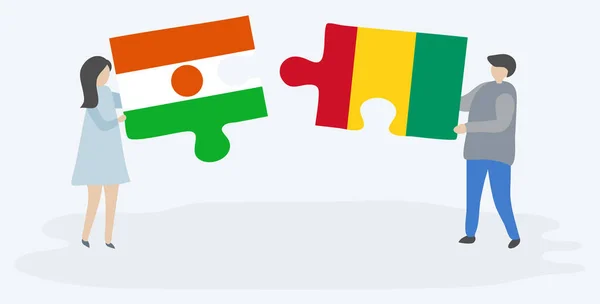 Couple Tenant Deux Pièces Puzzles Avec Des Drapeaux Nigériens Guinéens — Image vectorielle