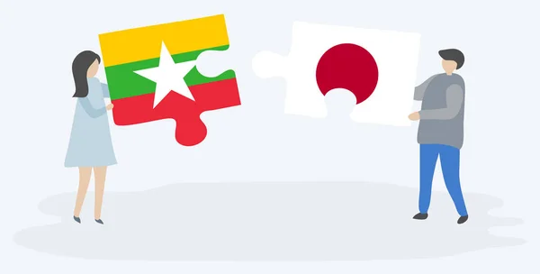 夫妇拿着两个拼图片与缅甸和日本国旗 缅甸和日本的国家符号在一起 — 图库矢量图片
