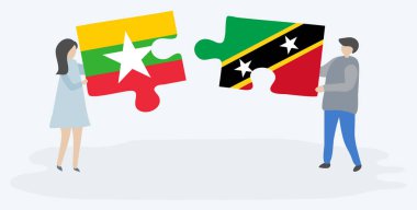 Çift Birmanya ve Kittitian bayrakları ile iki bulmaca parçaları tutan. Myanmar ve Saint Kitts ve Nevis ulusal sembolleri birlikte.