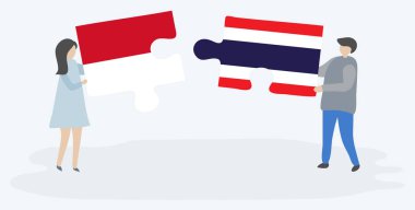 Monegasque ve Tay bayrakları ile iki bulmaca parçaları tutan çift. Monako ve Tayland ulusal sembolleri birlikte.