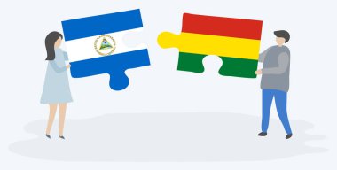 Nikaragua ve Bolivya bayrakları ile iki bulmaca parçaları tutan çift. Nikaragua ve Bolivya ulusal sembolleri birlikte.