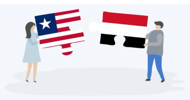 Liberya ve Yemen bayrakları ile iki bulmaca parçaları tutan çift. Liberya ve Yemen ulusal sembolleri birlikte.