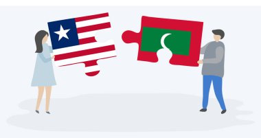 Liberya ve Maldiv bayrakları ile iki bulmaca parçaları tutan çift. Liberya ve Maldivler ulusal semboller birlikte.