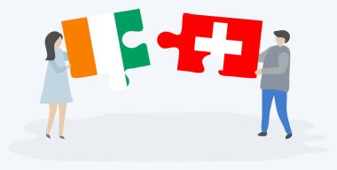 Çift Fildişi ve İsviçre bayrakları ile iki bulmaca parçaları tutan. Fildişi Sahili ve İsviçre ulusal sembolleri birlikte.