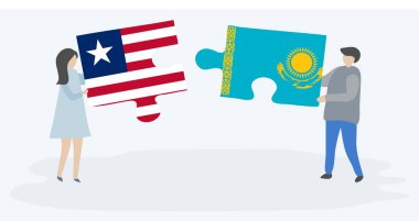 Liberya ve Kazak bayrakları ile iki bulmaca parçaları tutan çift. Liberya ve Kazakistan ulusal sembolleri birlikte.