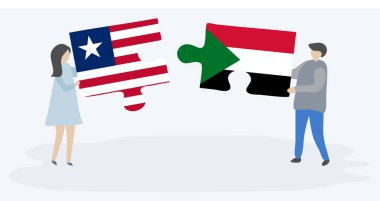 Liberya ve Sudan bayraklarıyla iki bulmaca tutan çift. Liberya ve Sudan ulusal sembolleri birlikte.