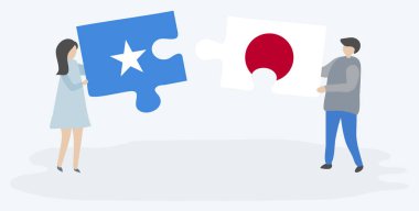 Çift, Somali ve Japon bayraklarıyla iki bulmaca parçası tutuyor. Somali ve Japonya ulusal sembolleri birlikte.