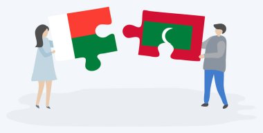 Çift Malagasy ve Maldiv bayrakları ile iki bulmaca parçaları tutan. Madagaskar ve Maldivler ulusal semboller birlikte.