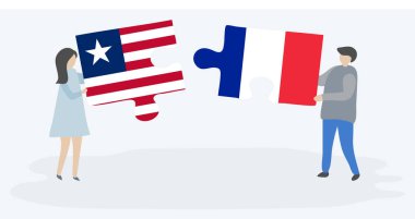 Liberya ve Fransız bayrakları ile iki bulmaca parçaları tutan çift. Liberya ve Fransa ulusal sembolleri birlikte.