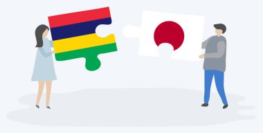 Çift Moritanya ve Japon bayrakları ile iki bulmaca parçaları tutan. Mauritius ve Japonya ulusal sembolleri birlikte.