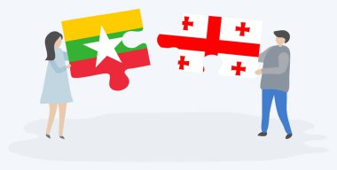 Birmanya ve Gürcü bayrakları ile iki bulmaca parçaları tutan çift. Myanmar ve Gürcistan ulusal sembolleri birlikte.