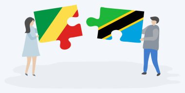 Kongo ve Tanzanya bayrakları ile iki bulmaca parçaları tutan çift. Kongo Cumhuriyeti ve Tanzanya ulusal sembolleri birlikte.