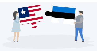 Liberya ve Estonya bayrakları ile iki bulmaca parçaları tutan çift. Liberya ve Estonya ulusal sembolleri birlikte.