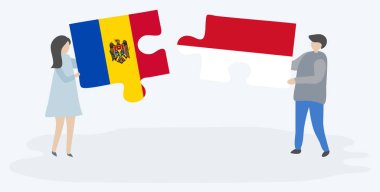 Moldova ve Endonezya bayrakları ile iki bulmaca parçaları tutan çift. Moldova ve Endonezya ulusal sembolleri birlikte.