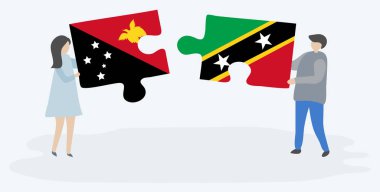 Papuan ve Kittitian bayrakları ile iki bulmaca parçaları tutan çift. Papua Yeni Gine ve Saint Kitts ve Nevis ulusal sembolleri birlikte.