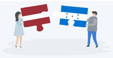 Leton ve Honduras bayrakları ile iki bulmaca parçaları tutan çift. Letonya ve Honduras ulusal sembolleri birlikte.