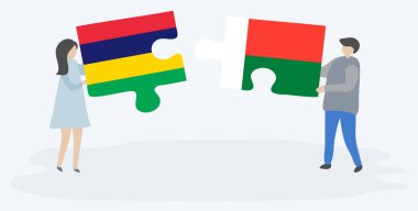 Çift Moritanya ve Malagasy bayrakları ile iki bulmaca parçaları tutan. Mauritius ve Madagaskar ulusal sembolleri birlikte.