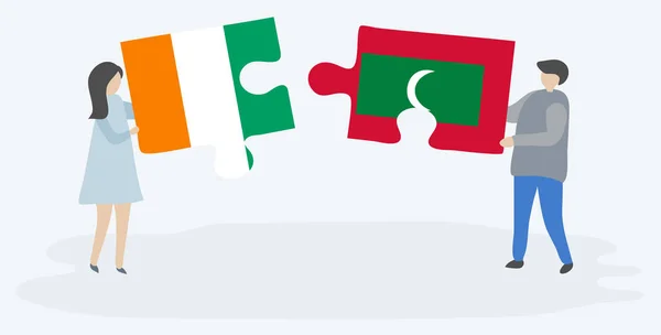 Paar Mit Zwei Puzzleteilen Mit Ivorischen Und Maledivischen Flaggen Elfenbeinküste — Stockvektor