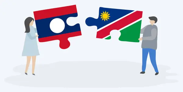 Pareja Sosteniendo Dos Piezas Rompecabezas Con Banderas Lao Namibia Laos — Vector de stock