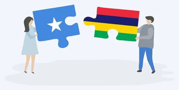 Casal Segurando Duas Peças Quebra Cabeças Com Bandeiras Somalis Maurícias — Vetor de Stock
