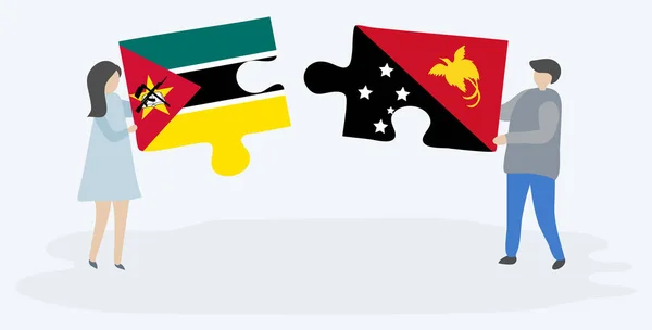 Ζευγάρι Που Κρατά Δύο Κομμάτια Παζλ Σημαίες Μοζαμβίκης Και Papuan — Διανυσματικό Αρχείο