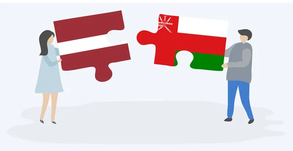 Пара Держащих Две Головоломки Латвийскими Оманскими Флагами Латвия Оман Вместе — стоковый вектор