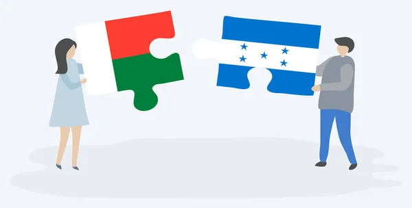Paar Mit Zwei Puzzleteilen Mit Madagassischen Und Honduranischen Flaggen Madagaskar — Stockvektor