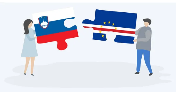 一对夫妇拿着两个拼图片与斯洛文尼亚和佛得角国旗 斯洛文尼亚和佛得角国家符号在一起 — 图库矢量图片