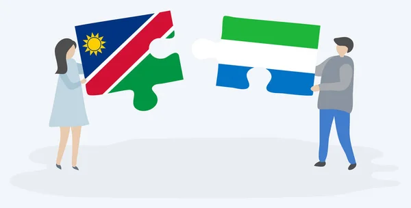 Pareja Sosteniendo Dos Piezas Rompecabezas Con Banderas Namibia Sierra Leona — Vector de stock