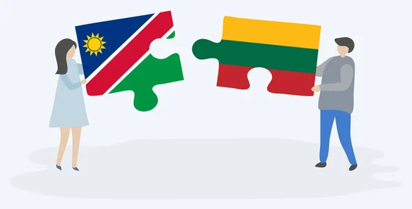 Pareja Sosteniendo Dos Piezas Rompecabezas Con Banderas Namibia Lituania Namibia — Vector de stock