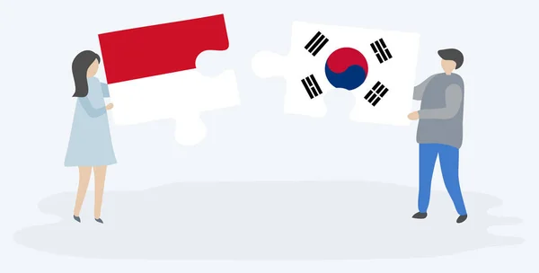 一对夫妇拿着两块拼图 上面挂着摩纳哥和韩国国旗 摩纳哥和韩国的国家符号在一起 — 图库矢量图片