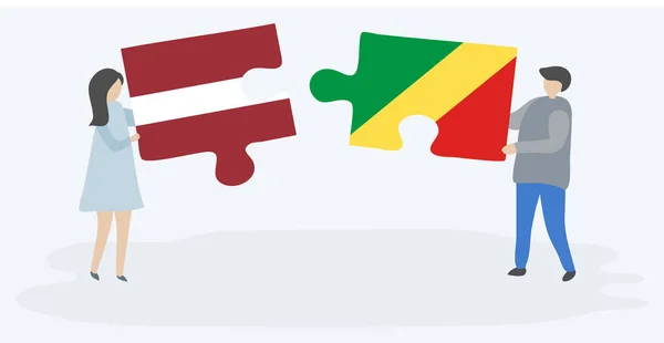 Dvojice Která Drží Dvě Skládanky Lotyšskými Konžskými Vlajkami Národní Symboly — Stockový vektor