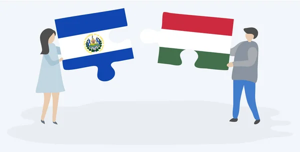 Salvador Macar Bayrakları Ile Iki Bulmaca Parçaları Tutan Çift Salvador — Stok Vektör
