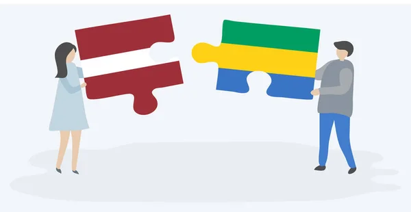 Casal Segurando Duas Peças Quebra Cabeças Com Bandeiras Letãs Gabonesas — Vetor de Stock