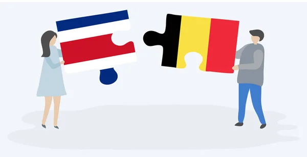 Paar Houden Twee Puzzels Stukken Met Costa Ricaanse Belgische Vlaggen — Stockvector