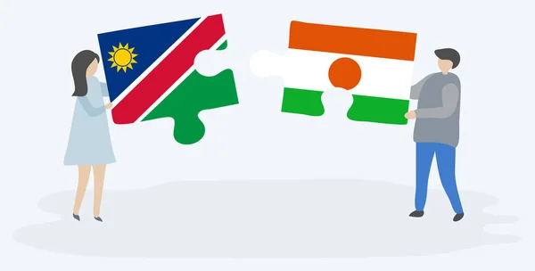 Pareja Sosteniendo Dos Piezas Rompecabezas Con Banderas Namibia Nigeria Namibia — Vector de stock
