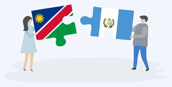 Pareja Sosteniendo Dos Piezas Rompecabezas Con Banderas Namibia Guatemala Namibia — Vector de stock