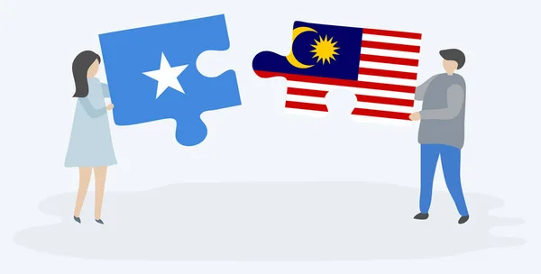 Paar Houden Twee Puzzels Stukken Met Somalische Maleisische Vlaggen Somalië — Stockvector