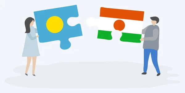 一对夫妇拿着两块拼图 上面挂着帕劳和尼日尔国旗 帕劳和尼日尔国家符号在一起 — 图库矢量图片