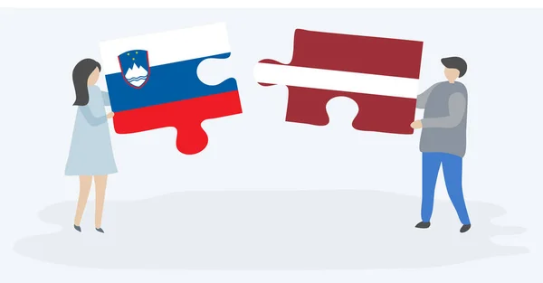 Couple Holding Two Puzzles Pieces Slovenian Latvian Flags Slovenia Latvia — Stock Vector