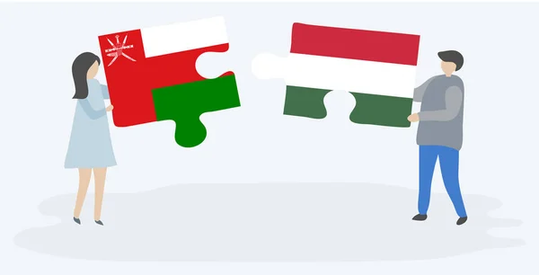 Couple Holding Two Puzzles Pieces Omani Hungarian Flags Oman Hungary — Stock Vector